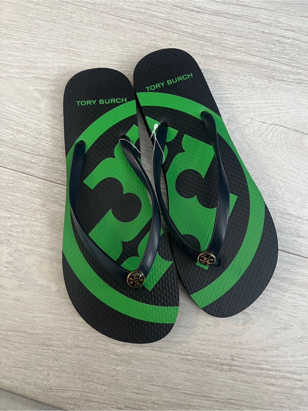 Tory Burch Black Flip Flops with Gold Logo Detail